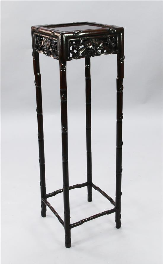 A tall Chinese rosewood stand, early 20th century, width 35cm square, height 115.5cm